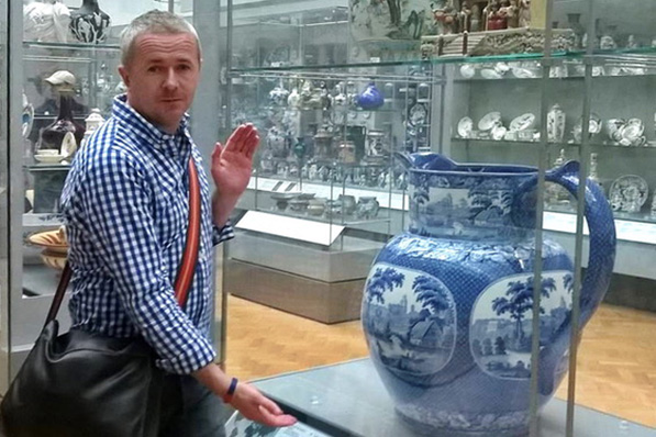 man looking at an exhibit